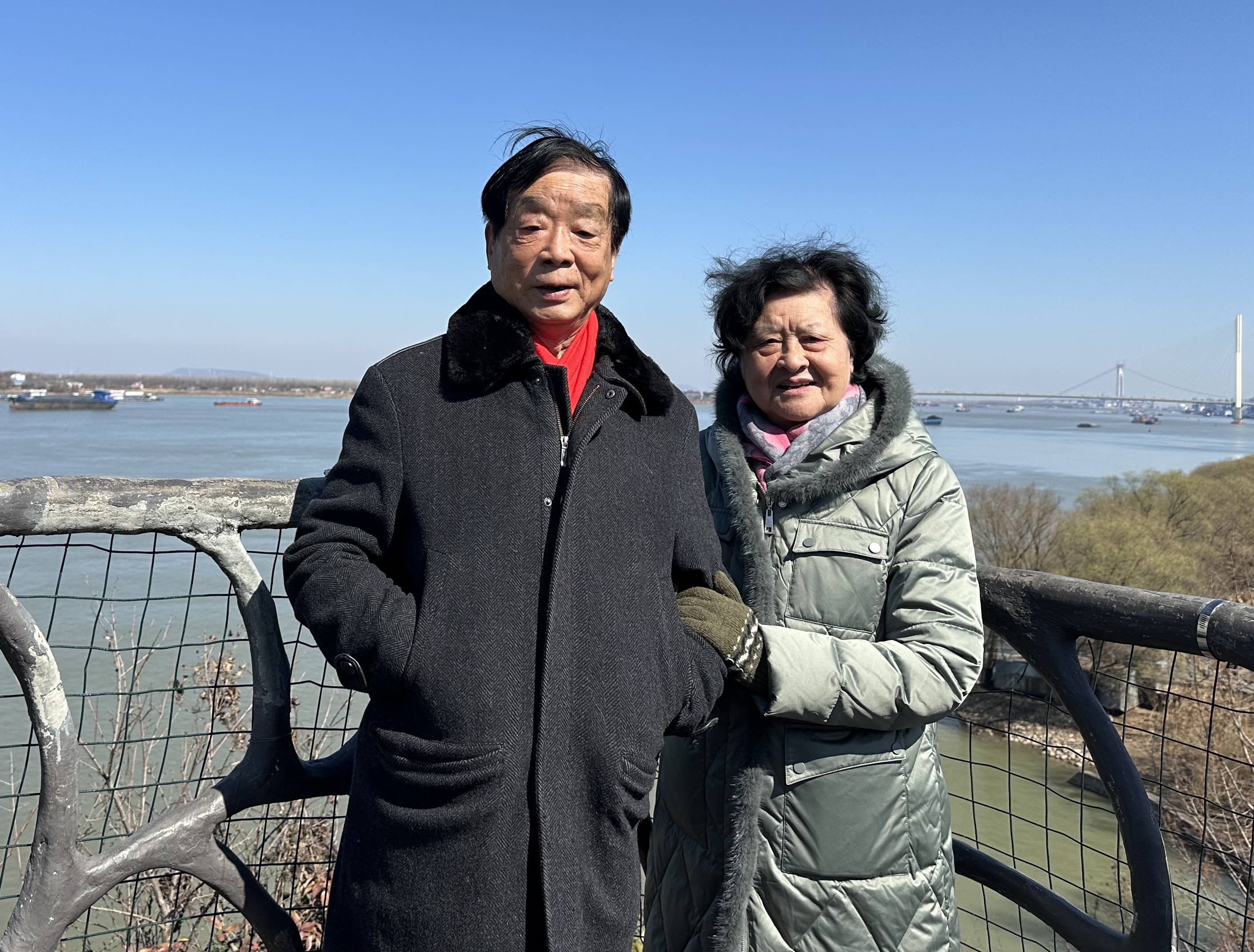 My maternal grandparents by the water