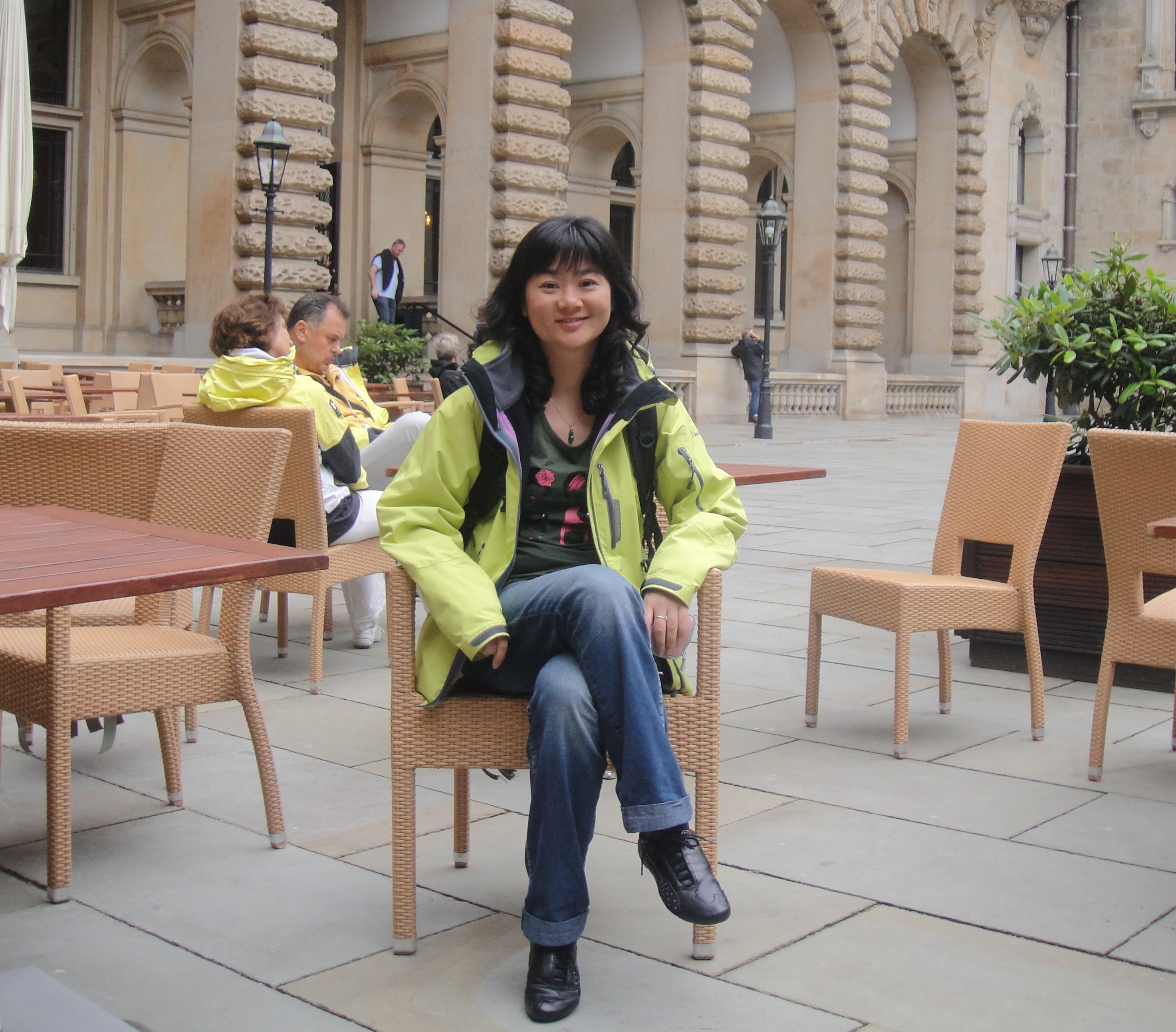 My mother seated in a city courtyard
